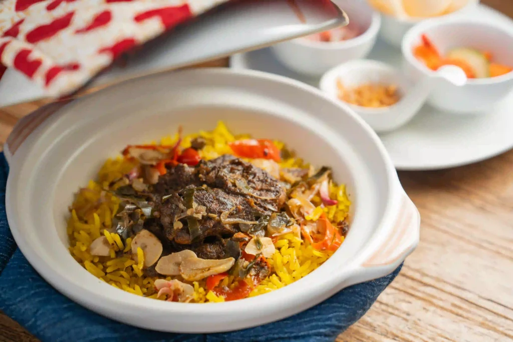 Authentic traditional Balinese chicken rendang kecicang served in traditional ceramic bowl with fragrant rice